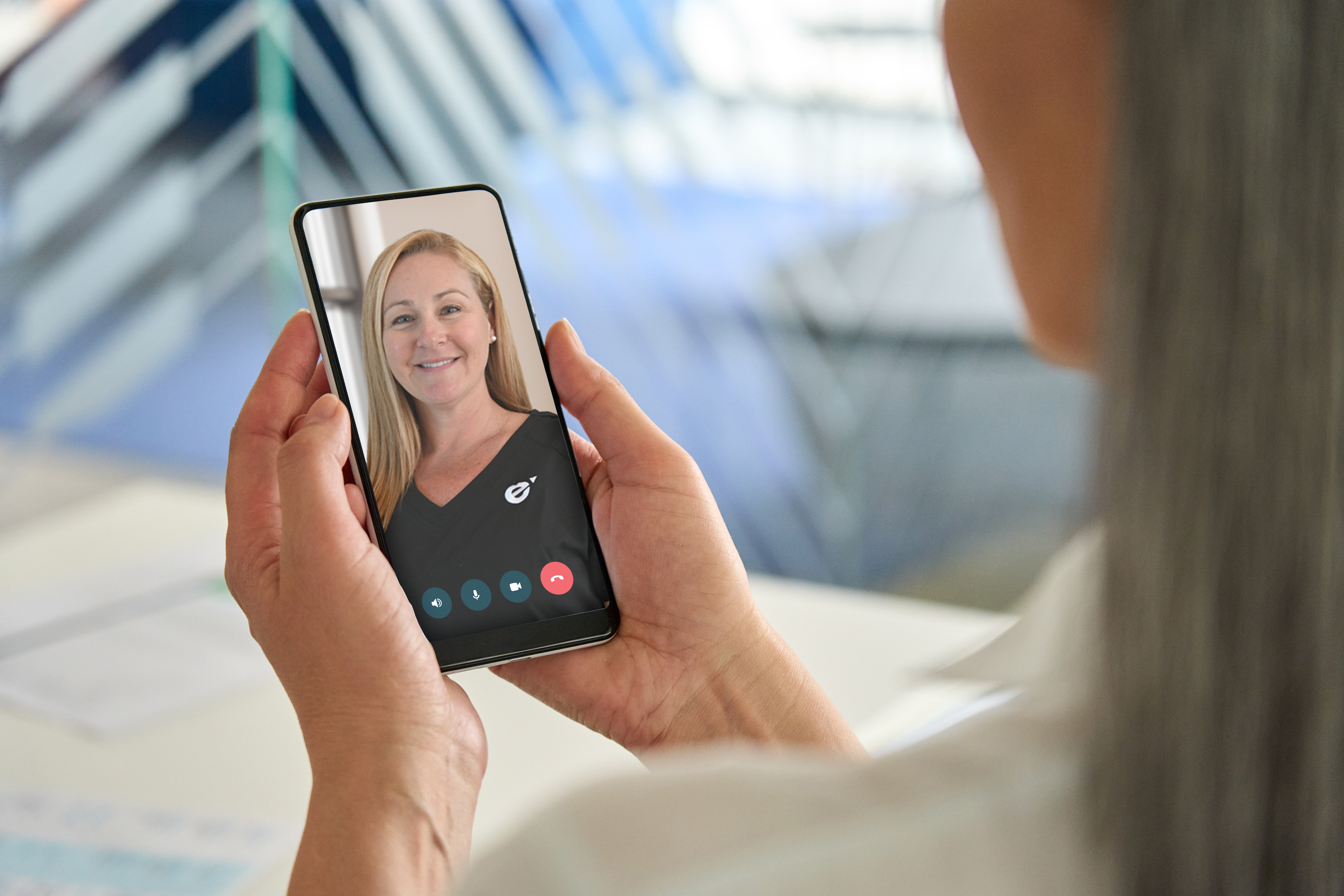 A woman on a video visit with a Fem Excel provider on her phone